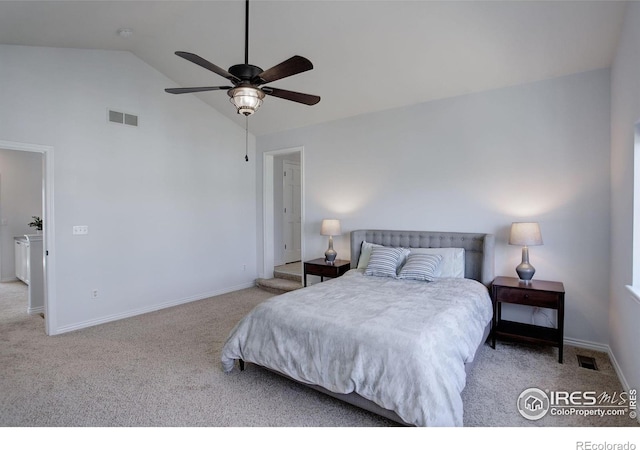 carpeted bedroom featuring lofted ceiling, baseboards, visible vents, and a ceiling fan