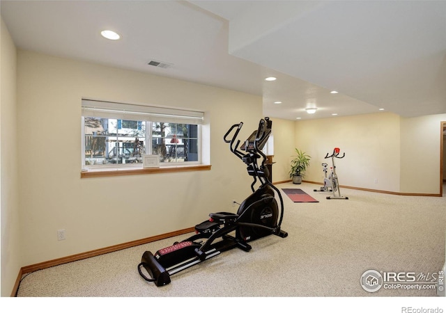 exercise area featuring baseboards, carpet flooring, visible vents, and recessed lighting