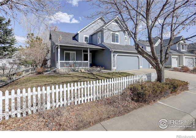 view of front facade featuring driveway, covered porch, a fenced front yard, and a garage