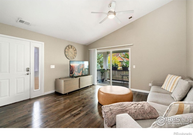 living room with dark wood-style floors, baseboards, visible vents, and vaulted ceiling