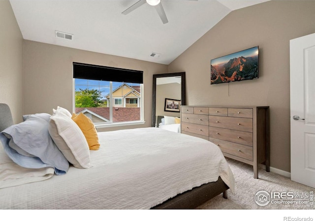 bedroom with light carpet, lofted ceiling, visible vents, and a ceiling fan