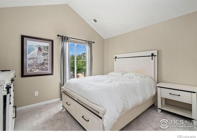 bedroom with light colored carpet, visible vents, vaulted ceiling, and baseboards