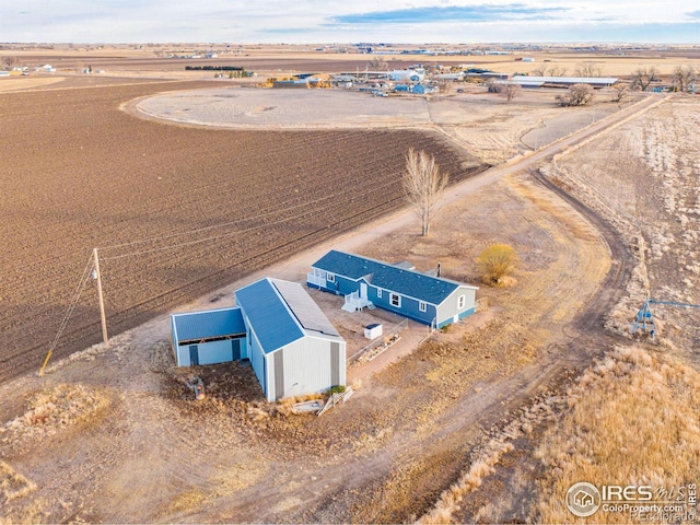 birds eye view of property featuring a rural view