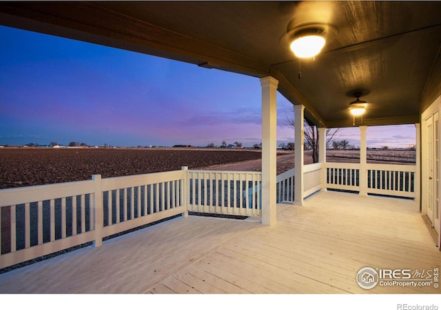 deck at dusk with ceiling fan