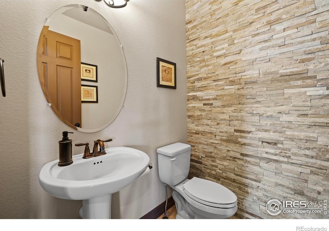 bathroom with a sink and toilet