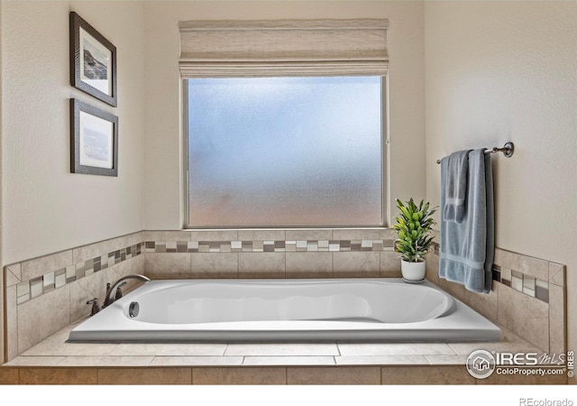 bathroom with a garden tub