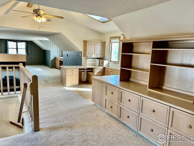 bonus room featuring lofted ceiling, plenty of natural light, light carpet, and a textured ceiling