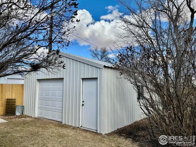 garage featuring fence