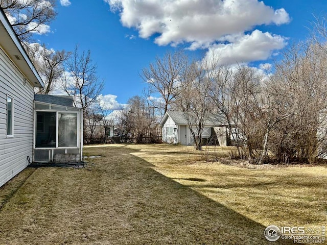 view of yard featuring a sunroom