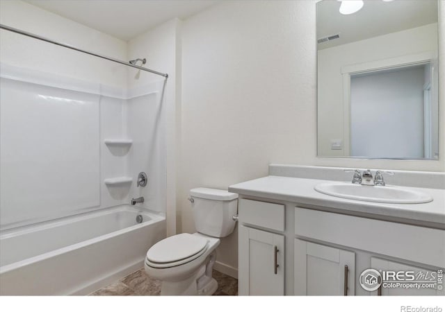 bathroom with toilet, visible vents, tub / shower combination, and vanity