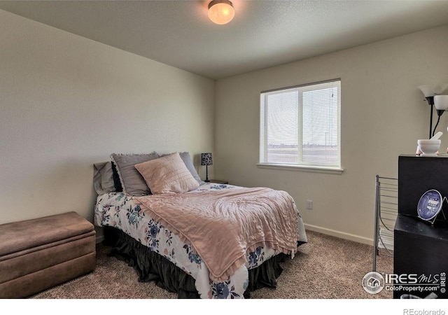 carpeted bedroom with baseboards