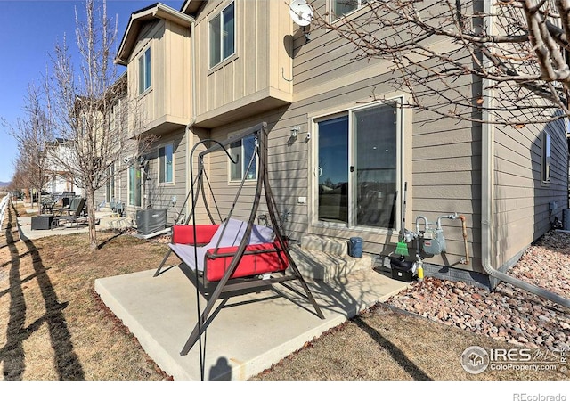 exterior space with a patio area and central AC unit