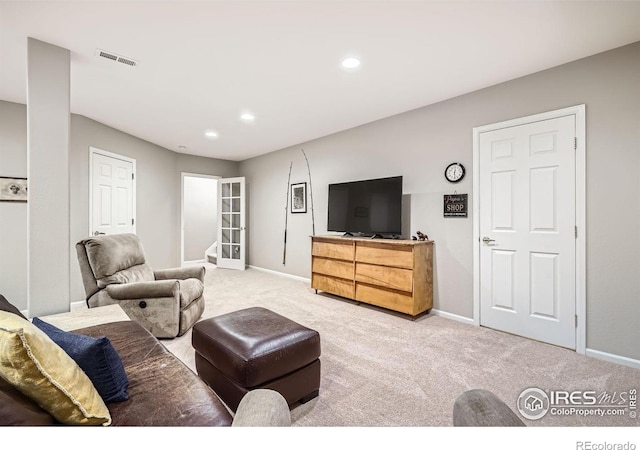 carpeted living area with french doors, recessed lighting, visible vents, and baseboards