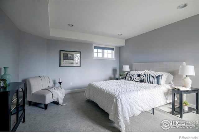 bedroom featuring carpet and baseboards