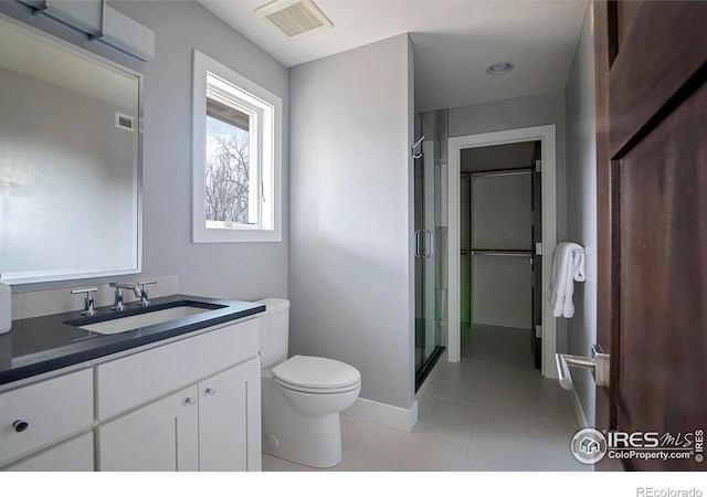 full bath featuring visible vents, toilet, tile patterned floors, vanity, and a shower stall