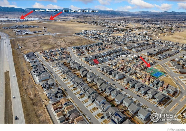 2719 Tallgrass Ln, Berthoud, CO 80513 - aerial view of property and surrounding area featuring a mountain backdrop and nearby suburban area
