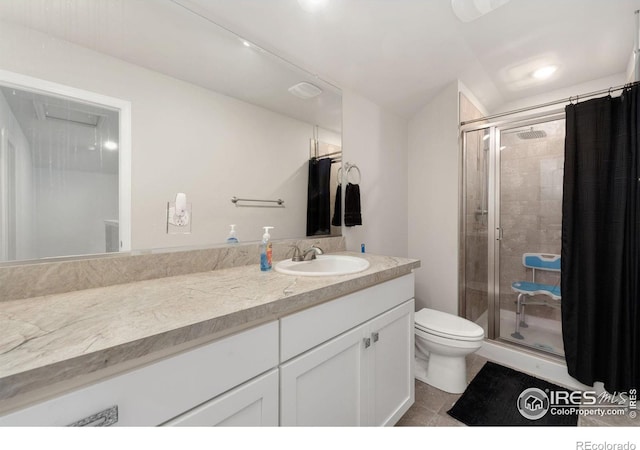2719 Tallgrass Ln, Berthoud, CO 80513 - full bathroom with a shower stall, toilet, vanity, and tile patterned floors