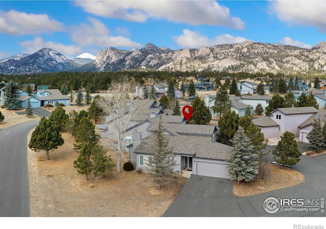 bird's eye view featuring a mountain view and a residential view