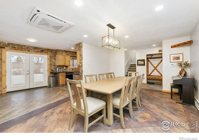 dining room featuring french doors, stairway, wood finished floors, and recessed lighting