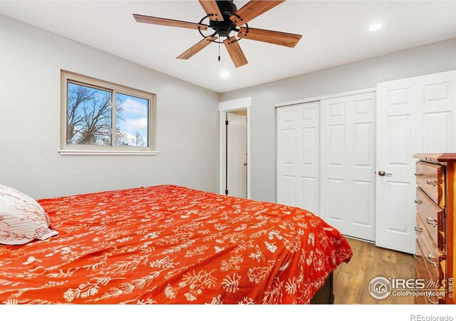 bedroom featuring ceiling fan, a closet, wood finished floors, and recessed lighting