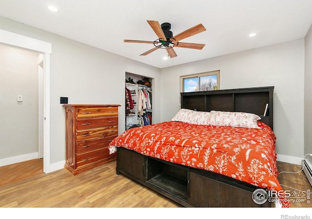 bedroom with ceiling fan, recessed lighting, wood finished floors, baseboards, and a closet