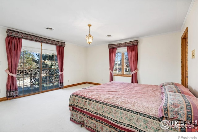 carpeted bedroom featuring visible vents, crown molding, and baseboards