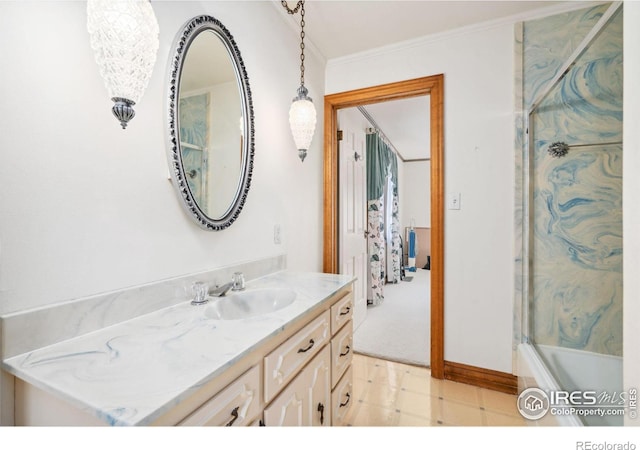 bathroom with tile patterned floors, crown molding, vanity, and a bathing tub