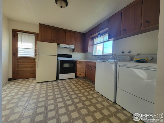 laundry area featuring light floors, laundry area, and washer and clothes dryer