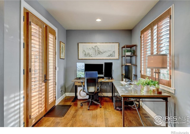 office space featuring recessed lighting, baseboards, wood finished floors, and french doors