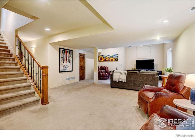 living room with recessed lighting, visible vents, light carpet, baseboards, and stairs