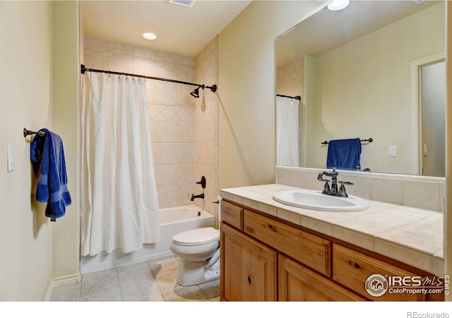 full bath featuring visible vents, toilet, shower / bath combo with shower curtain, vanity, and tile patterned floors