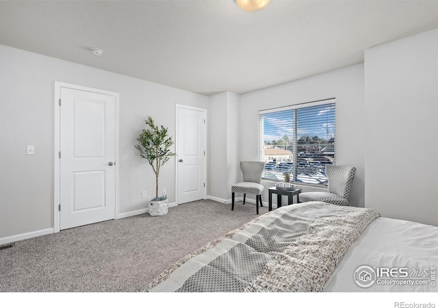 bedroom with carpet and baseboards