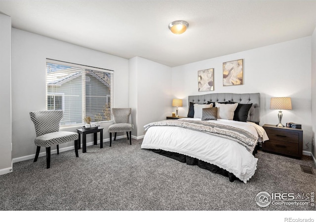 bedroom with carpet, visible vents, and baseboards