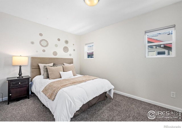 bedroom with carpet and baseboards