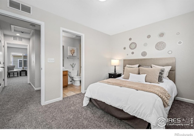 bedroom with baseboards, visible vents, attic access, and light colored carpet