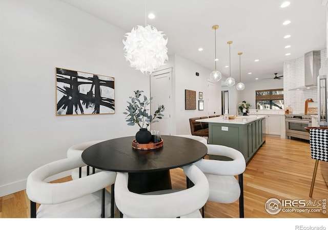 510 Wood St, Fort Collins, CO 80521 - dining space with light wood finished floors, recessed lighting, a chandelier, and ceiling fan