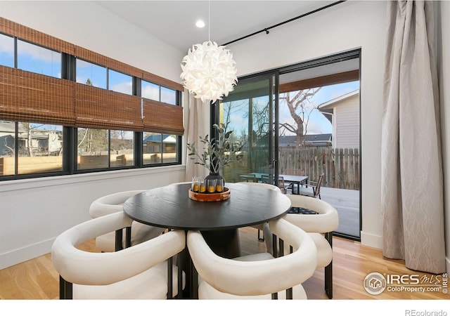 510 Wood St, Fort Collins, CO 80521 - dining area with a chandelier, baseboards, wood finished floors, plenty of natural light, and recessed lighting