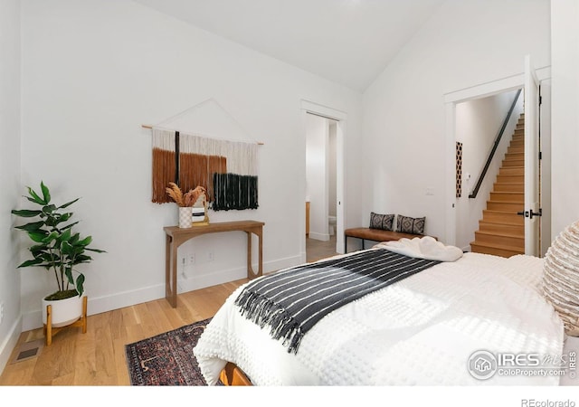 510 Wood St, Fort Collins, CO 80521 - bedroom featuring vaulted ceiling, wood finished floors, and baseboards