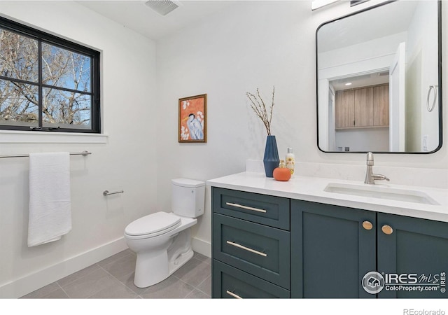 510 Wood St, Fort Collins, CO 80521 - bathroom with toilet, baseboards, tile patterned flooring, and vanity