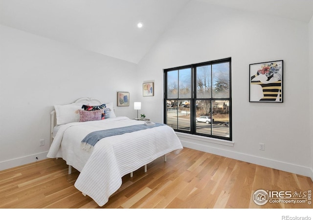 510 Wood St, Fort Collins, CO 80521 - bedroom with high vaulted ceiling, baseboards, recessed lighting, and light wood-type flooring