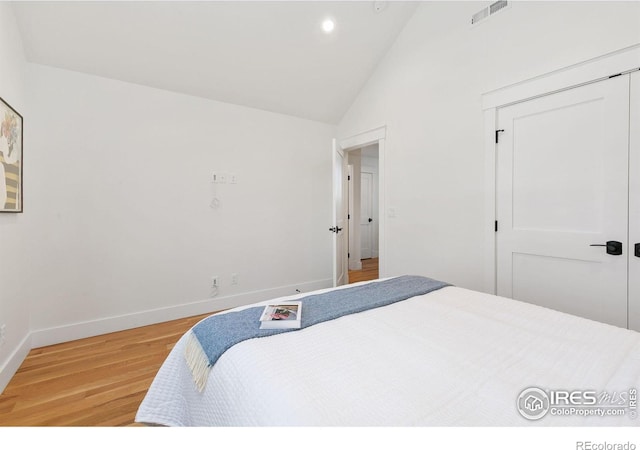 510 Wood St, Fort Collins, CO 80521 - bedroom featuring light wood-type flooring, recessed lighting, baseboards, high vaulted ceiling, and a closet