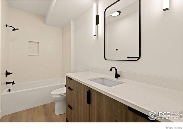 510 Wood St, Fort Collins, CO 80521 - full bathroom with wood finished floors, toilet, vanity, and tub / shower combination