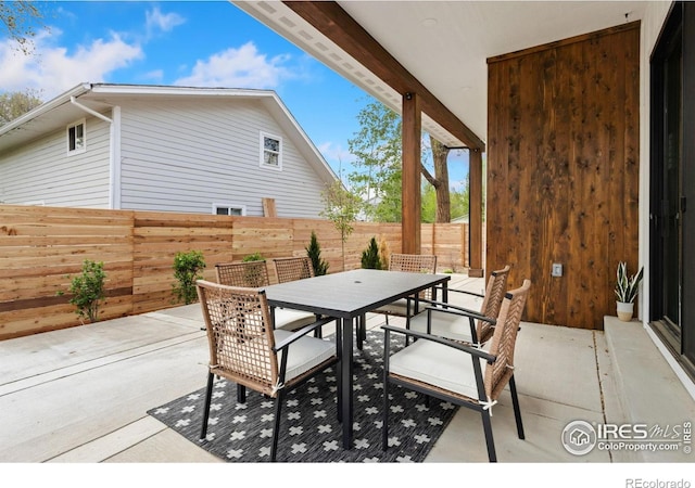 510 Wood St, Fort Collins, CO 80521 - view of patio / terrace with outdoor dining area and a fenced backyard