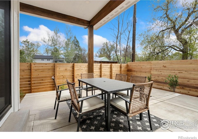 510 Wood St, Fort Collins, CO 80521 - view of patio / terrace with outdoor dining space and a fenced backyard
