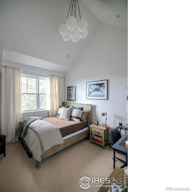 carpeted bedroom featuring a chandelier and high vaulted ceiling