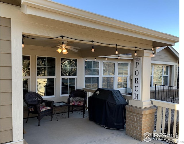 view of patio with a grill and a ceiling fan