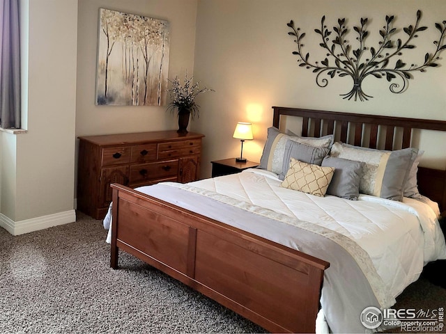 carpeted bedroom with baseboards