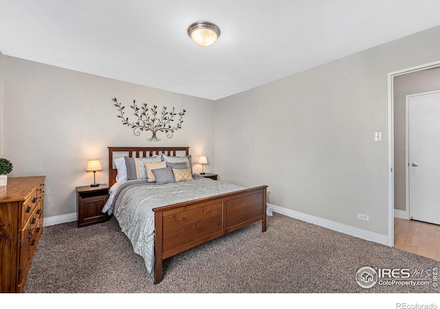 carpeted bedroom with baseboards