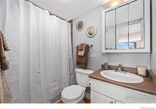 full bathroom with vanity and toilet