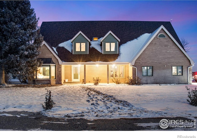 view of front of home with brick siding